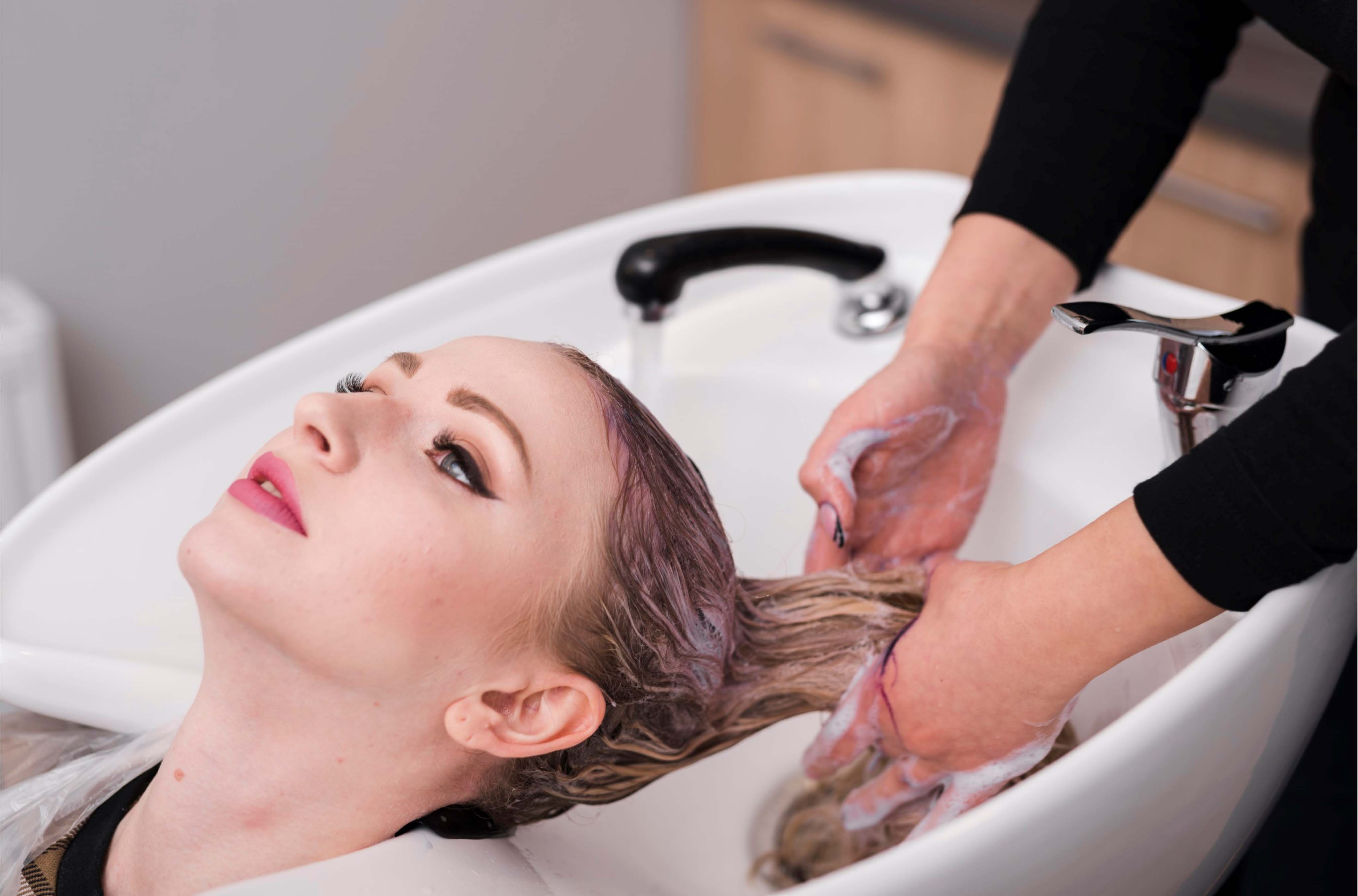 Various hair care bottles and tubes